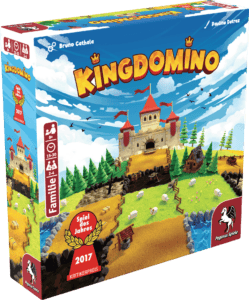 Bunte Spielbox mit mittelalterlichem Burgmotiv und Domino-Steinen.
